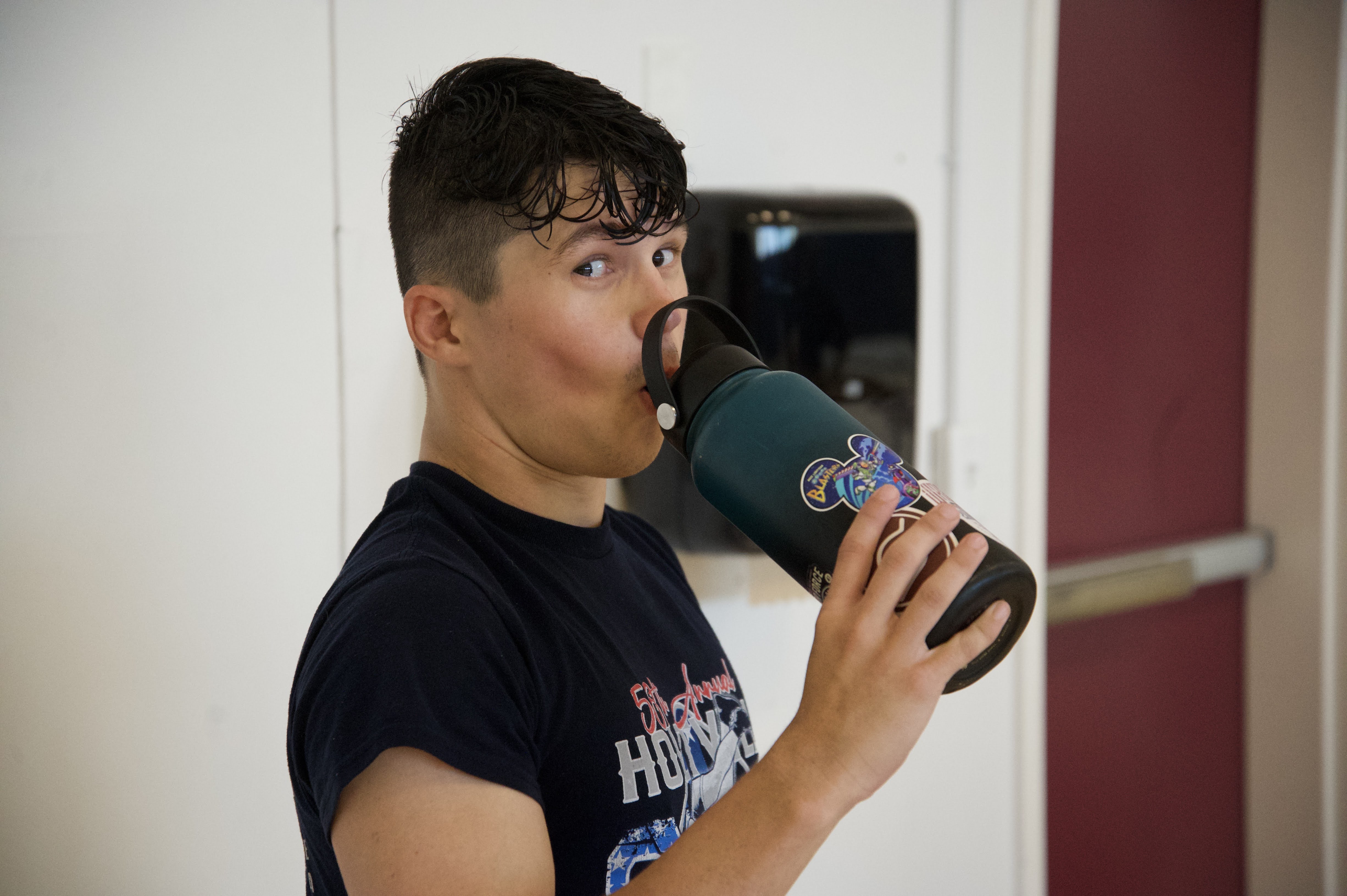 Wrestler grabs drink of water